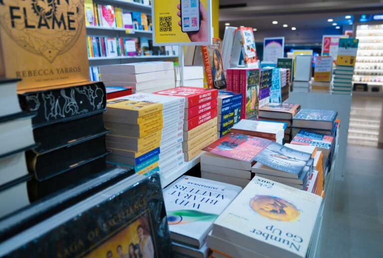 A display table filled with new and bestselling books inside a modern bookstore, representing 2025 book market trends including the rise of Korean literature, AI-related titles, and shifting reader preferences.