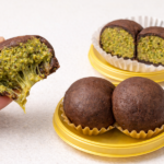 Photo-style image of Dubai chewy cookies with a soft, gooey center, chocolate chunks, and pistachio toppings, freshly baked and ready to serve.