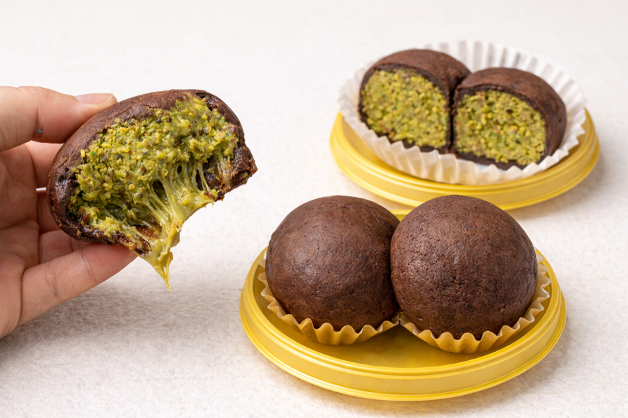 Photo-style image of Dubai chewy cookies with a soft, gooey center, chocolate chunks, and pistachio toppings, freshly baked and ready to serve.